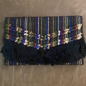 Black and metallic colored clutch